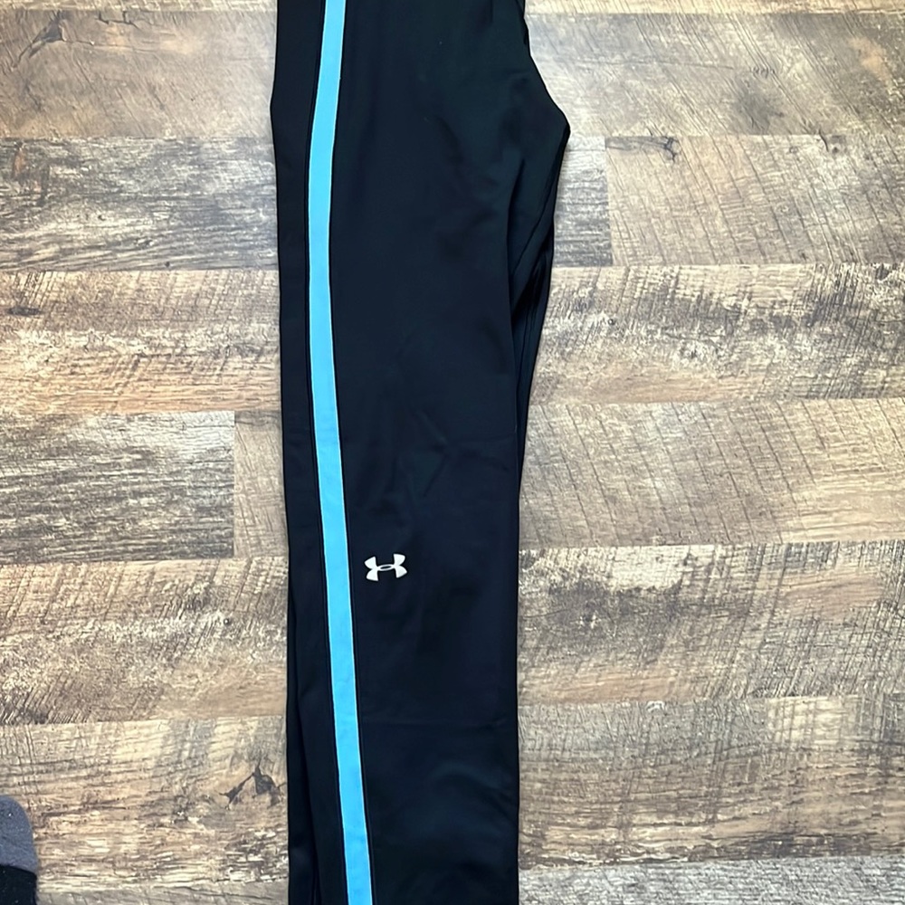 Black under armor leggings with blue stripes on the side